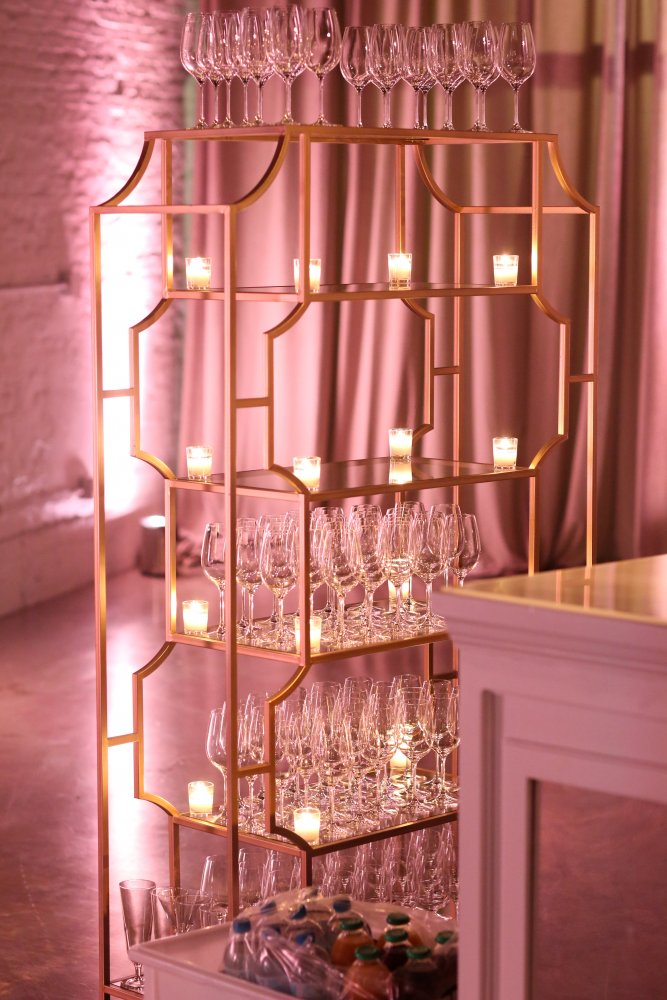 gold bamboo bar shelving at wedding reception